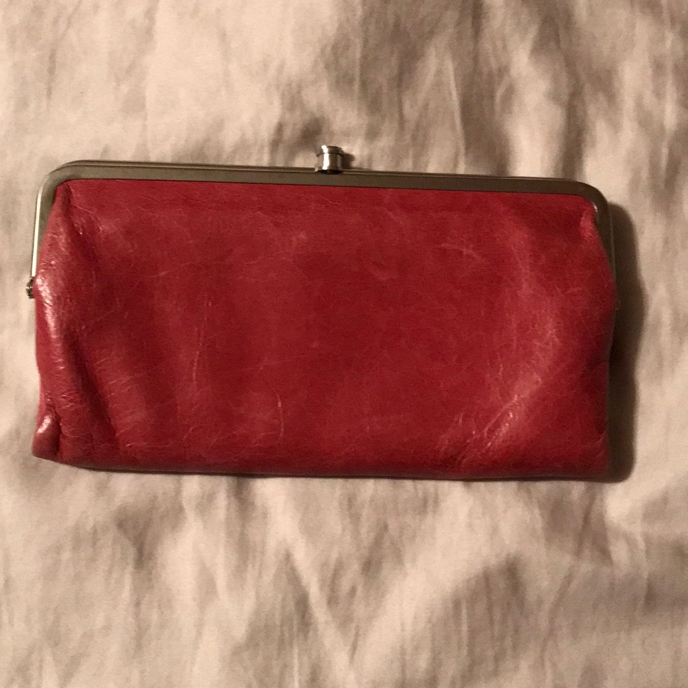 HOBO Lauren wallet pink in color.
